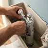 Flomasta Chasse d'eau + robinet flotteur bas , double bouton poussoir + étrier